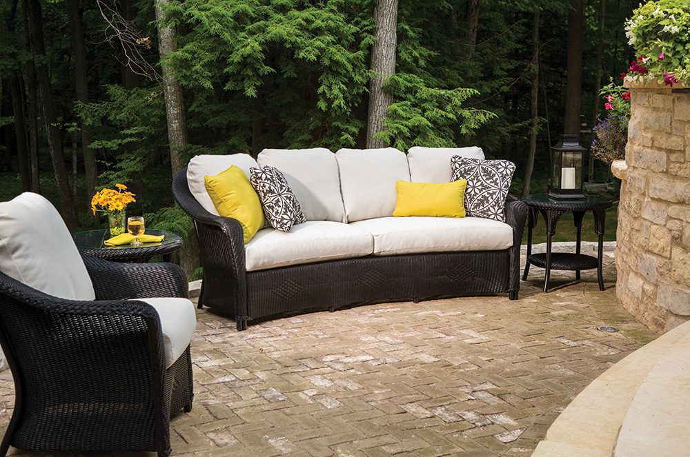 white wicker furniture with black and white striped cushions